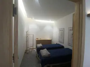 不太疼颈肩推拿馆（群力店）的logo