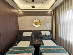 疆美足迹养生馆的logo