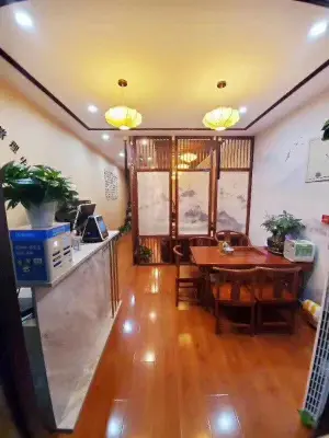 明明匠心采耳馆（阳光城店）的logo